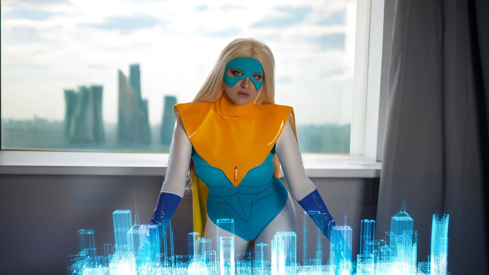 Superheroine in Action: Model Reveals Blondie Blazer Cosplay from the Game Dispatch Superheroine in Action: Model Reveals Blondie Blazer Cosplay from the Game Dispatch
